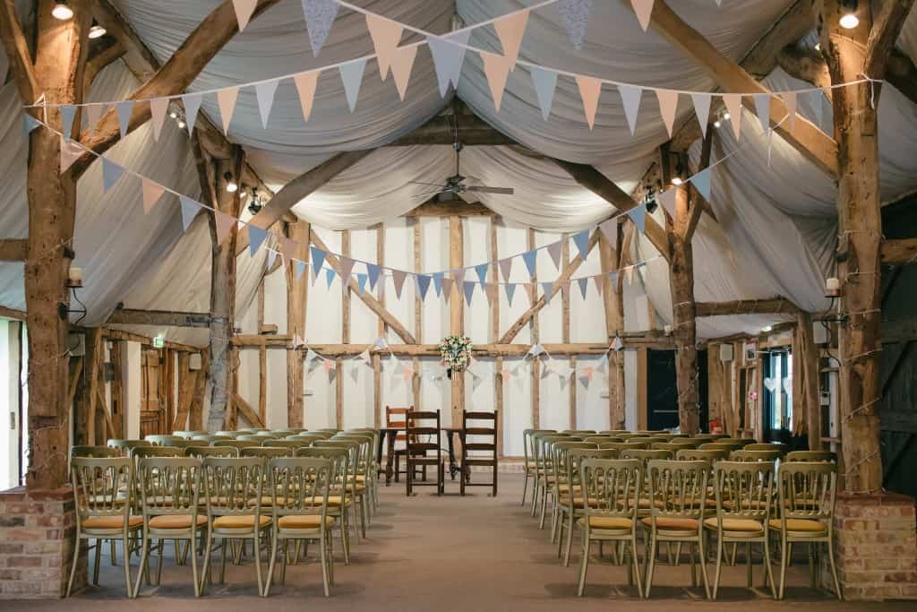 Tudor Barn Set for Ceremony with pretty bunting at South Farm 