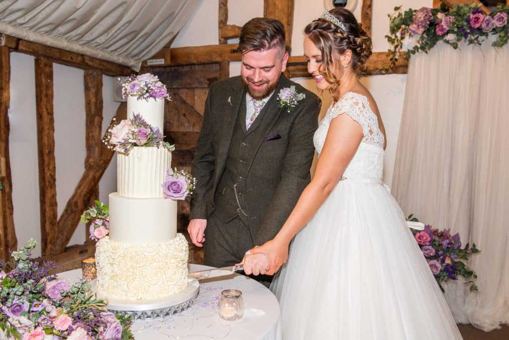 Bride & Groom Cut the Wedding Cake at South Farm Wedding Venue