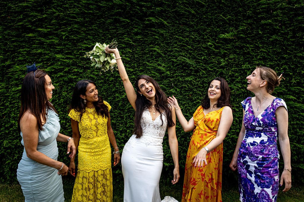 Bride with girlfriends enjoying the moment at Farm wedding venue